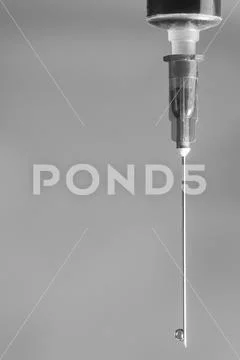 Medical syringe needle close-up with space for signature Stock Photos