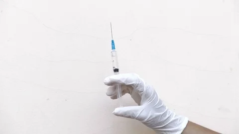 A medical syringe splashes Stock Footage 78771717
