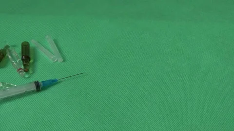 Medical syringes and vials with orange Stock Footage 59120432