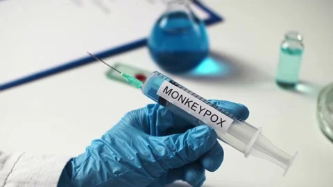 Medical table with a glass slide for testing blood for the monkeypox virus. 動画素材 197100489
