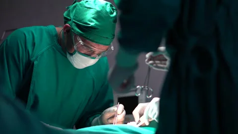 The medical team and nurses  Performing Surgical Operation patients in the op Stock Footage 141413020