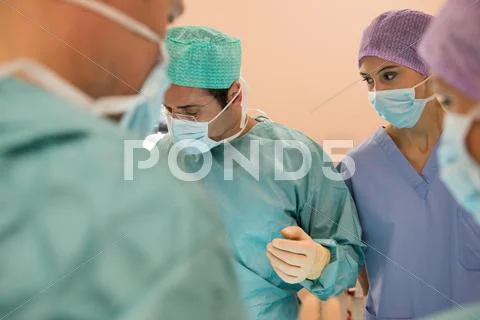 Medical Team Performing An Operation In An Operating Room