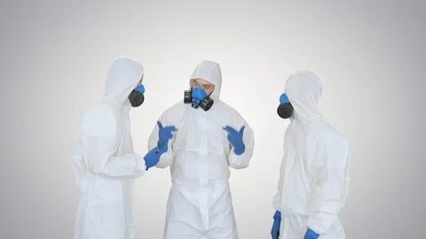 Medical team in protection clothes stacking and rising hands Teamwork concept on Stock Footage 128012291