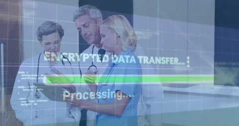 Medical team reviewing encrypted data transfer in medical clinic, showing tablet Stock Footage 307466049