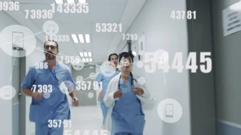 Medical team running ER corridor upon code call, causing data overlay showing Stock Footage 330004355