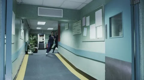 Medical team rush to meet a hospital emergency Stock Footage