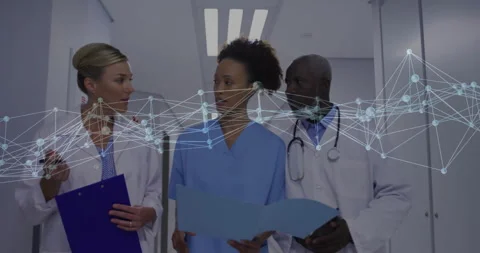Medical team scanning chart while noting points on tablet and discussing case Stock Footage 312099918