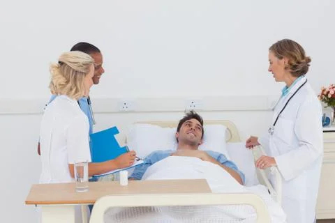 Medical team taking care of a sick patient Stock Photos