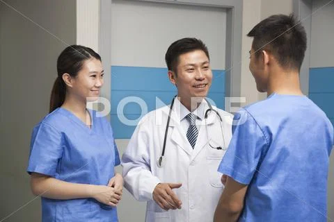 Medical Team Talking In Hospital Stock Photos