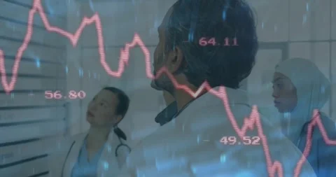 Medical team tapping tablet causing overlay data graph while scanning procedure Stock Footage 327782425