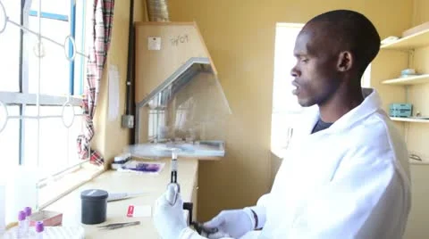 Medical technician testing blood, using manual centrifuge. Stock-Footage 8976248