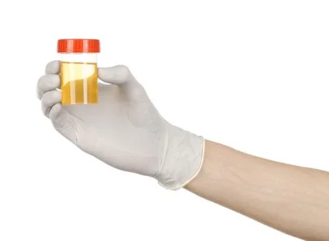 Medical theme: doctor's hand in white gloves holding a transparent containe.. Stock Photos