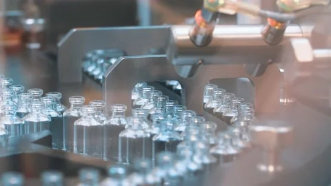 Medical vials on the automatic production line of vaccines and injections Stock Footage 127894402