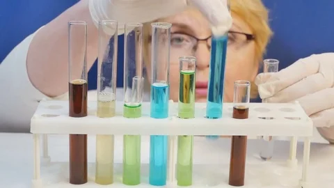 Medical worker makes analyses with tubes Video stock 84251059