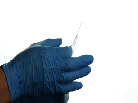 Medical worker preparing an injection. Closeup hands in medical gloves. Video stock 84832097
