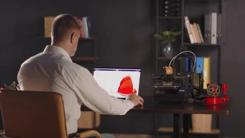 Medical worker uses a laptop, develops and creates a sketch of heart in 스톡 동영상 260068245