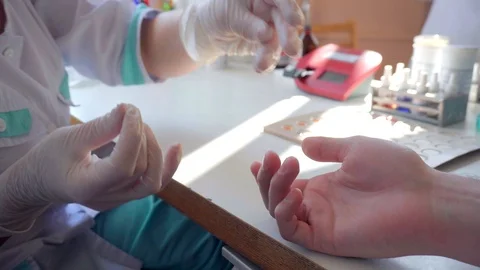 Medical workers take blood samples on the patient's fingers for health screening Stock Footage 91069326