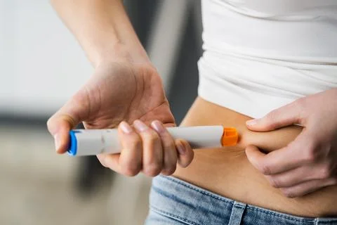 Medicament Self Injection In Belly Using Syringe Stock Photos