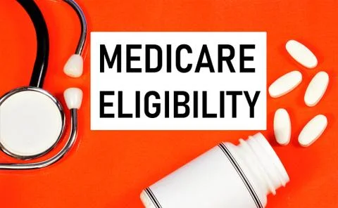 Medicare eligibility. Text label in the folder on the background of medicines Stock Photos