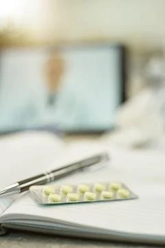 Medication and pen for taking quick notes Stock Photos