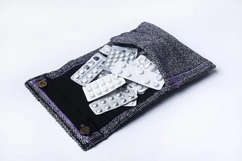 Medication holder in textile bag Stock Photos