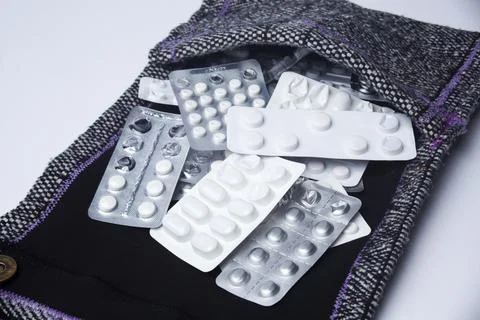 Medication holder in textile bag Stock Photos