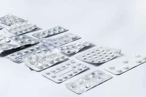 Medication holders in white background Stock Photos