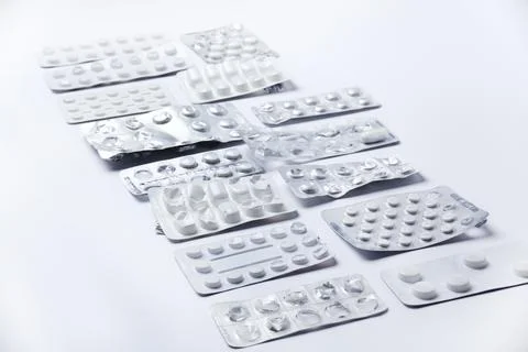 Medication holders in white background Stock Photos