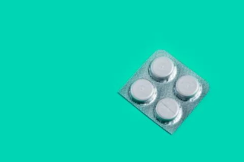 Medication pills on a plain background. copy space one Stock Photos