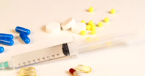 Medication pills syringe injection Stock Footage 142493022