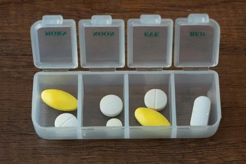 Medication in plastic container Stock Photos