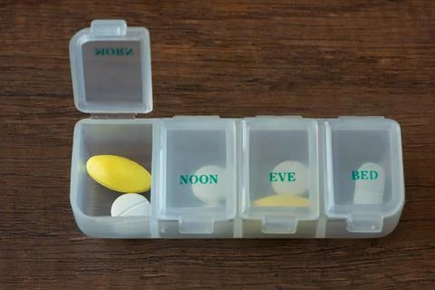 Medication in plastic container Stock Photos