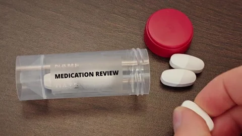 MEDICATION REVIEW pharmaceutical safety topic for medicine quality verification Stock Footage 338415912