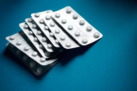 Medication tablets packed in blister pack on a table Stock Photos