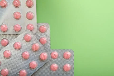Medication tablets packed in blister pack on a table Stock Photos