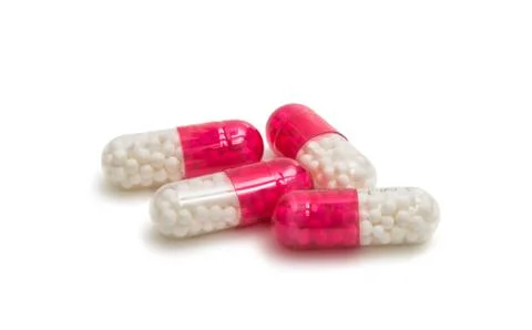 Medicinal capsules isolated Stock Photos