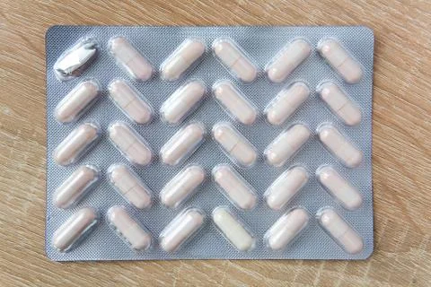 Medicinal preparations in capsules in packaging. Stock Photos