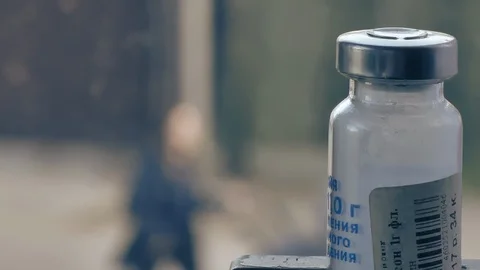 A medicine bottle in the foreground. Stock-Footage 127176441