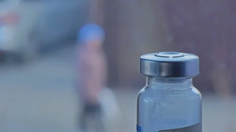 A medicine bottle in the foreground. View from the window Stock-Footage 127177498