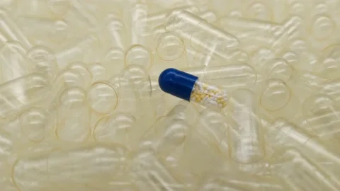 Medicine capsule in the middle of empty capsules Видео 167460942