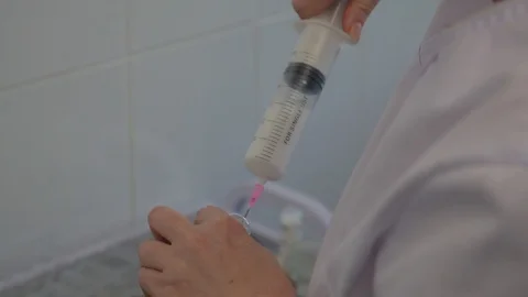 The medicine. closeup of nurse's hands. gaining in the syringe treatment Stock Footage 99200284