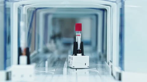 Medicine creation process. Close shot of test tubes with red caps moving away on Stock Footage 234019001