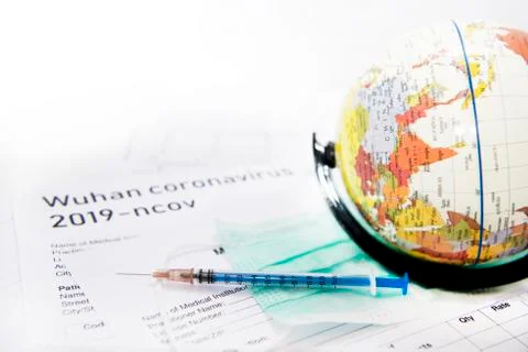 Medicine documents with small globe on it. Abstract photo of illness time. Stock Photos