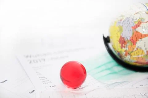 Medicine documents with small globe on it. Abstract photo of illness time. Stock Photos