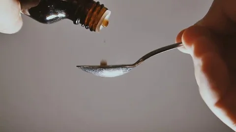 Medicine drop on a spoon Stock Footage 69074778