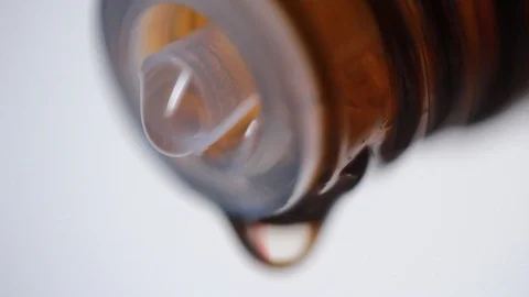 Medicine dropping from bottle. Super macro 動画素材 86894340