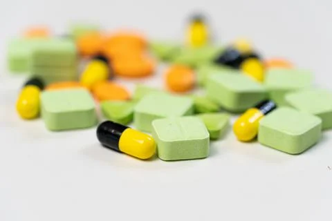 Medicine, including pills, tablets, and capsules on white background. 库存照片