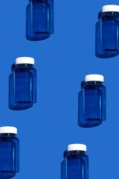 Medicine jar pattern on blue background, pharmaceutical flat lay texture to.. Stock Photos