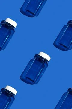 Medicine jar pattern on blue background, pharmaceutical flat lay texture to.. Stock Photos