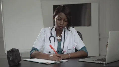 Medicine, people and healthcare concept - happy female african american doctor Stock Footage